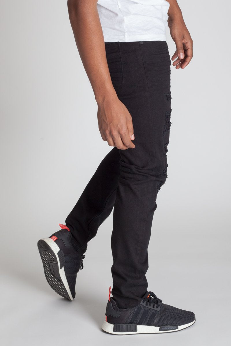 KDNK Patched and Distressed Skinny Jeans